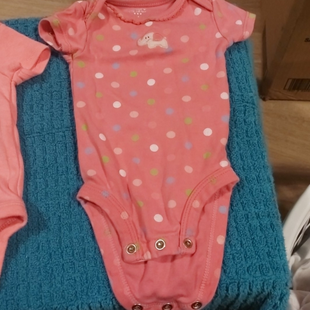 2 carters newborn onsies